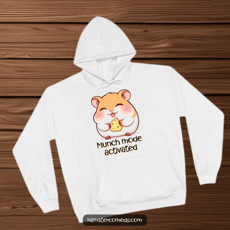 Funny hamster hoodie, eyes closed, happily munching cheese, radiating coziness and the pure joy of a simple snack.